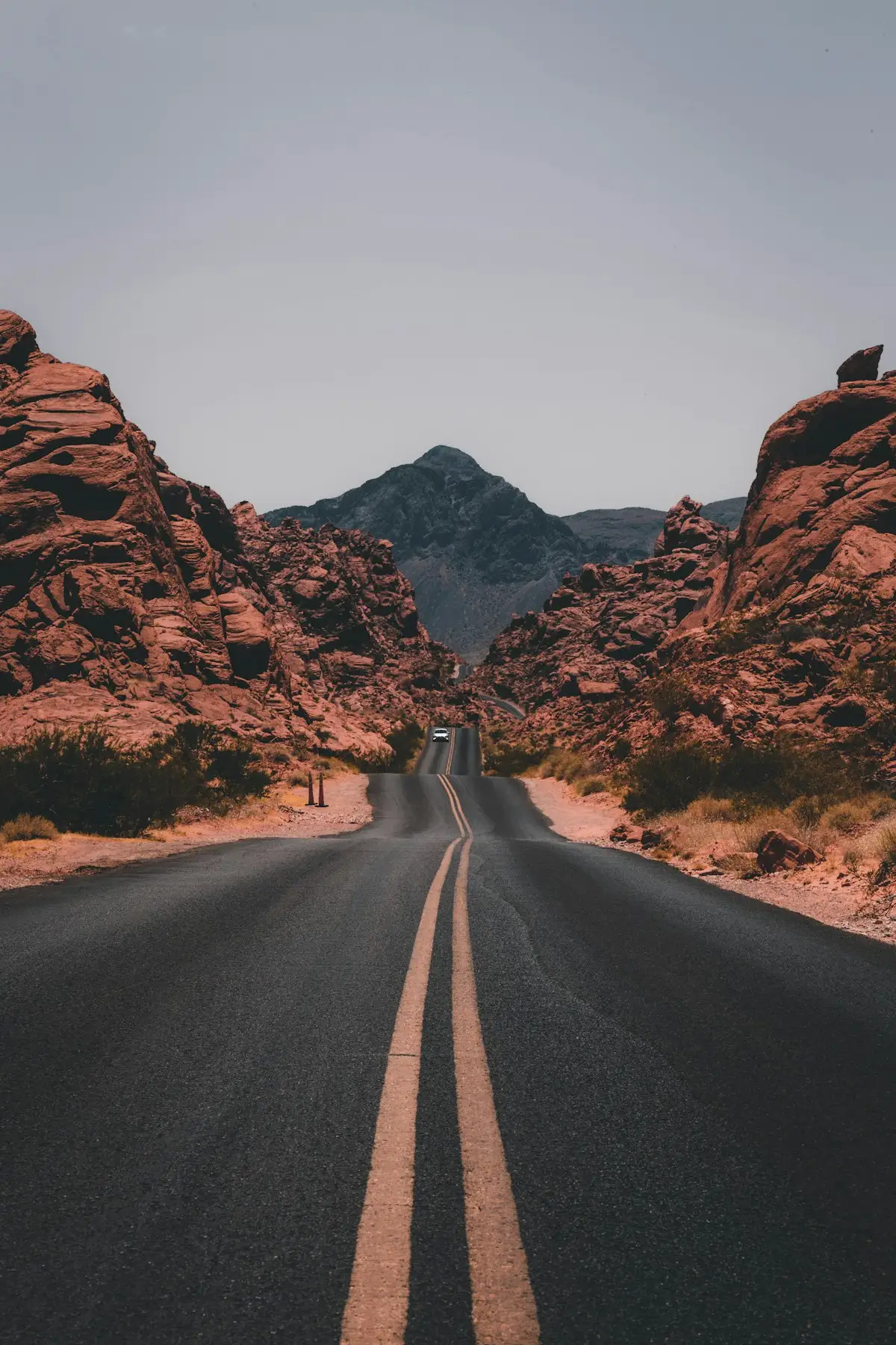 An empty road through red rock